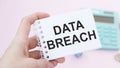 Text DATA BREACH on the table with colored paper clips and crumpled sheets Royalty Free Stock Photo