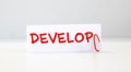 text DEVELOP on white paper Royalty Free Stock Photo