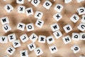 Text dice cube concept / Letter dices alphabet on wooden background. Block of alphabet studded on the floor