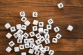 Text dice cube concept - Letter dices alphabet on wooden background