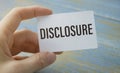 Text Disclosure on card. Concept meaning The action of making New or Secret Confidential