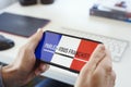 Text do you speak French in French in a smartphone Royalty Free Stock Photo
