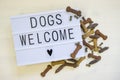 Text Dogs welcome wirtten on a lightbox