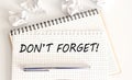 Text don`t forget on notepad on white background. meeting remind reminder note concept Royalty Free Stock Photo