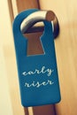 Text early riser in a door hanger Royalty Free Stock Photo