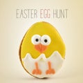 Text Easter egg hunt and chick in an egg Royalty Free Stock Photo