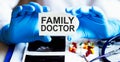 Text FAMILY DOCTOR write on a medicine card. Medical concept with a stethoscope and pills