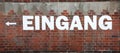 text EINGANG on the wall which means EXIT in german