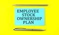 Text Employee Stock Ownership Plan on the blue sticker on the yellow background