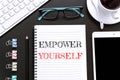Text Empower yourself on white paper background / business concept