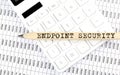 Text ENDPOINT SECURITY on the wooden pencil on the calculator with chart