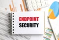 Text endpoint security written on notepad with financial charts, calculator and pen on desk Royalty Free Stock Photo