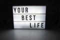 Text in english spelling Your Best Life on a lightbox