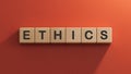 Text ETHICS on white notepad with cube block, stock concept.