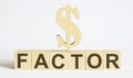Text FACTOR on wood cube block, stock investment concept