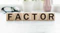 Text factor written on wooden cubes. risk factors. evaluation of sales factors