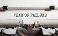 The text FAER OF FAILURE is typed on paper by an antique typewriter. Vintage inscription, retro style, grunge, concept Royalty Free Stock Photo