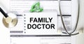 Text Family Doctor in a notebook on medical forms with a phonendoscope and green pills