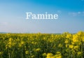 Text FAMINE against defocused agriculture field message. Global hunger, food crisis, inflation, high prices, increasing