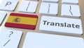 TRANSLATE text and flag of Spain on the buttons on the computer keyboard. Conceptual 3D rendering Royalty Free Stock Photo