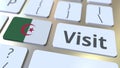 VISIT text and flag of Algeria on the buttons on the computer keyboard. Conceptual 3D rendering