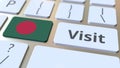 VISIT text and flag of Bangladesh on the buttons on the computer keyboard. Conceptual 3D rendering
