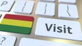 VISIT text and flag of Bolivia on the buttons on the computer keyboard. Conceptual 3D rendering