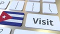 VISIT text and flag of Cuba on the buttons on the computer keyboard. Conceptual 3D rendering