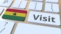 VISIT text and flag of Ghana on the buttons on the computer keyboard. Conceptual 3D rendering