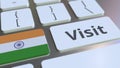 VISIT text and flag of India on the buttons on the computer keyboard. Conceptual 3D rendering