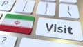 VISIT text and flag of Iran on the buttons on the computer keyboard. Conceptual 3D rendering
