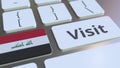 VISIT text and flag of Iraq on the buttons on the computer keyboard. Conceptual 3D rendering