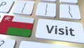 VISIT text and flag of Oman on the buttons on the computer keyboard. Conceptual 3D rendering