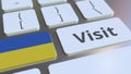 VISIT text and flag of Ukraine on the buttons on the computer keyboard. Conceptual 3D rendering