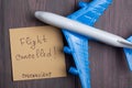 Text flights cancelled Coronavirus on sticky note and airplane model on wooden background