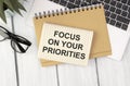 Focus on your priorities on note paper
