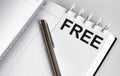 Text FREE on the short note texture background with pen Royalty Free Stock Photo