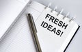 Text Fresh ideas on the short note texture background with pen Royalty Free Stock Photo