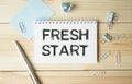 FRESH START on the short note texture background with pen. Business concept Royalty Free Stock Photo