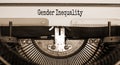 Text `gender inequality` typed on retro typewriter. Concept. Beautiful background