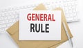 Text GENERAL RULE on the envelope on the keyboard