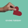 Text giving tuesday and man giving a red heart Royalty Free Stock Photo