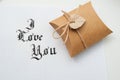 Text god bless you on paper texture and gift box with heart Royalty Free Stock Photo