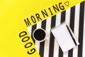 Text Good day, Coffee, and yellow rose on stylish black and white napkin on yellow background . Concept Flat lay Top view