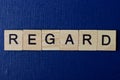 Text on gray word regard in small wooden letters