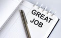 Text GREAT JOB on the short note texture background with pen Royalty Free Stock Photo