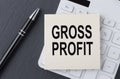 Text GROSS PROFIT on sticker on calculator, business concept Royalty Free Stock Photo