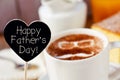 Text happy fathers day and a cup of cappuccino