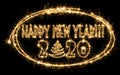 Text Happy New Year with number 2020 and Christmas tree inside the frame made by sparkler . Number 2020 and sign written sparkling Royalty Free Stock Photo