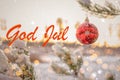 "God Jul" means "Merry Christmas" in Swedish and Norwegian. Blurred background of beautiful Christmas tree in